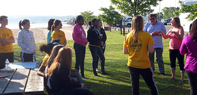 Mawby and Policchio discuss environmental and population health with the student