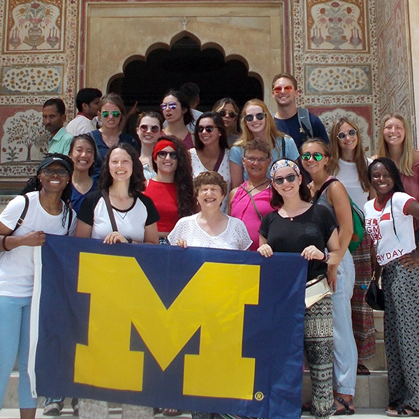 UM students with M flag in India