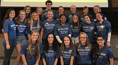 Group of students wearing Peer Mentor shirts