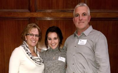 Katie and her parents at an ovarian cancer awareness fundraiser