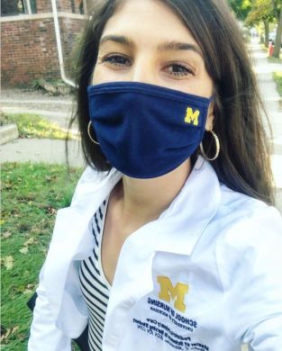 Student in mask and white coat