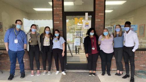 Masked students in front of clinic