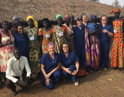 Zielinski (center, kneeling) with UMSN students and workshop participants in Uganda